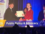 Eva receiving her award